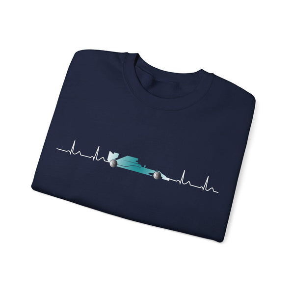 Folded navy blue t-shirt with a race car design on a white background