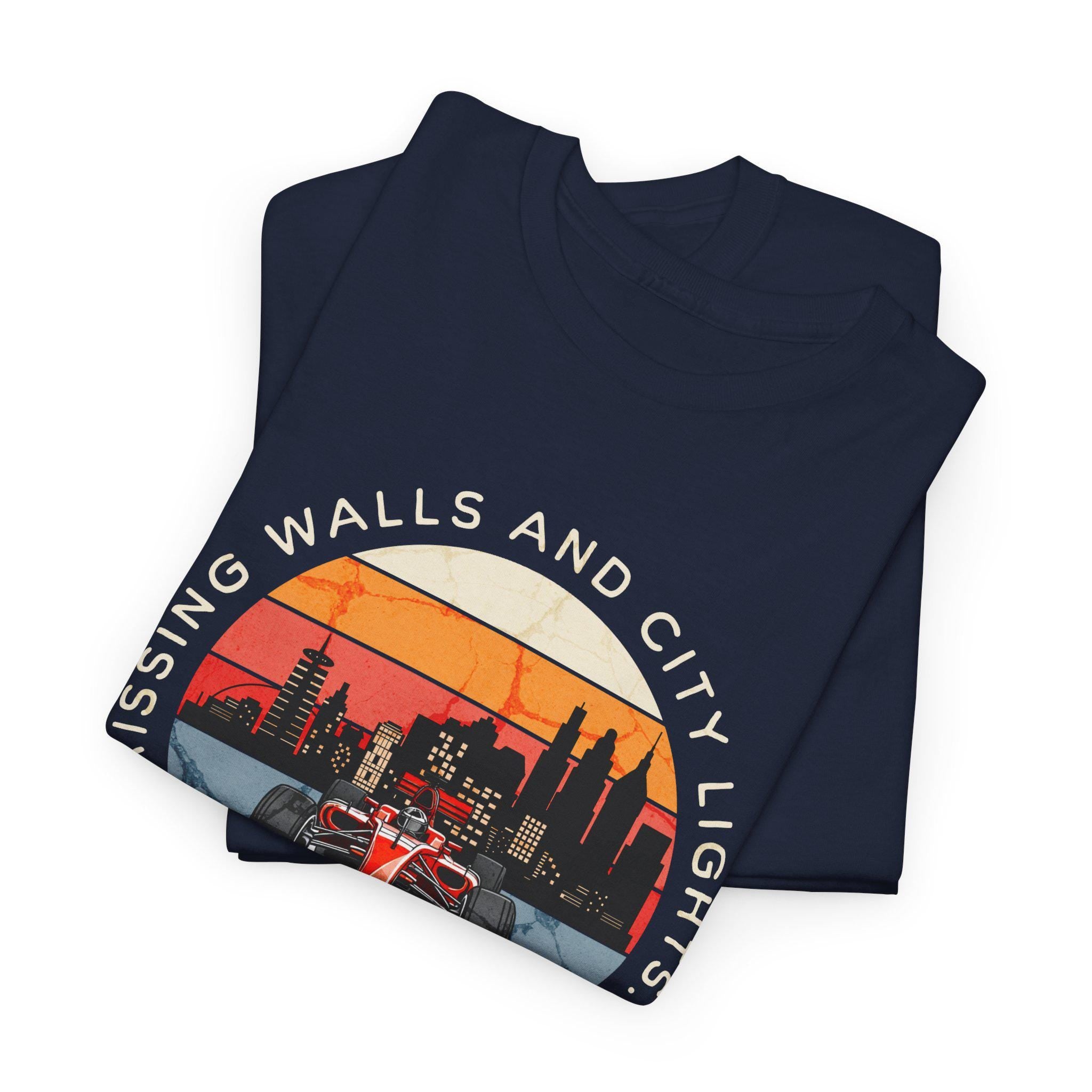 Folded navy blue t-shirt with cityscape design and text on a white background