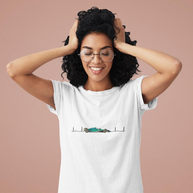 Woman wearing a white t-shirt with a graphic design on a beige background