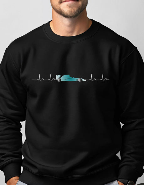 Person wearing a black sweatshirt with a f1 car graphic design on a plain background