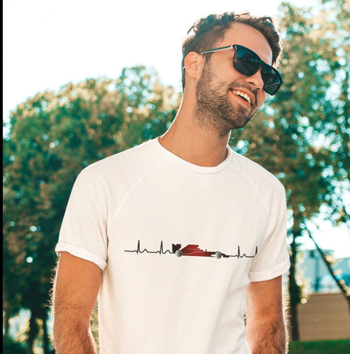 A white t-shirt with a black and red racing car graphic and a heartbeat line. The graphic is on the front of the shirt.