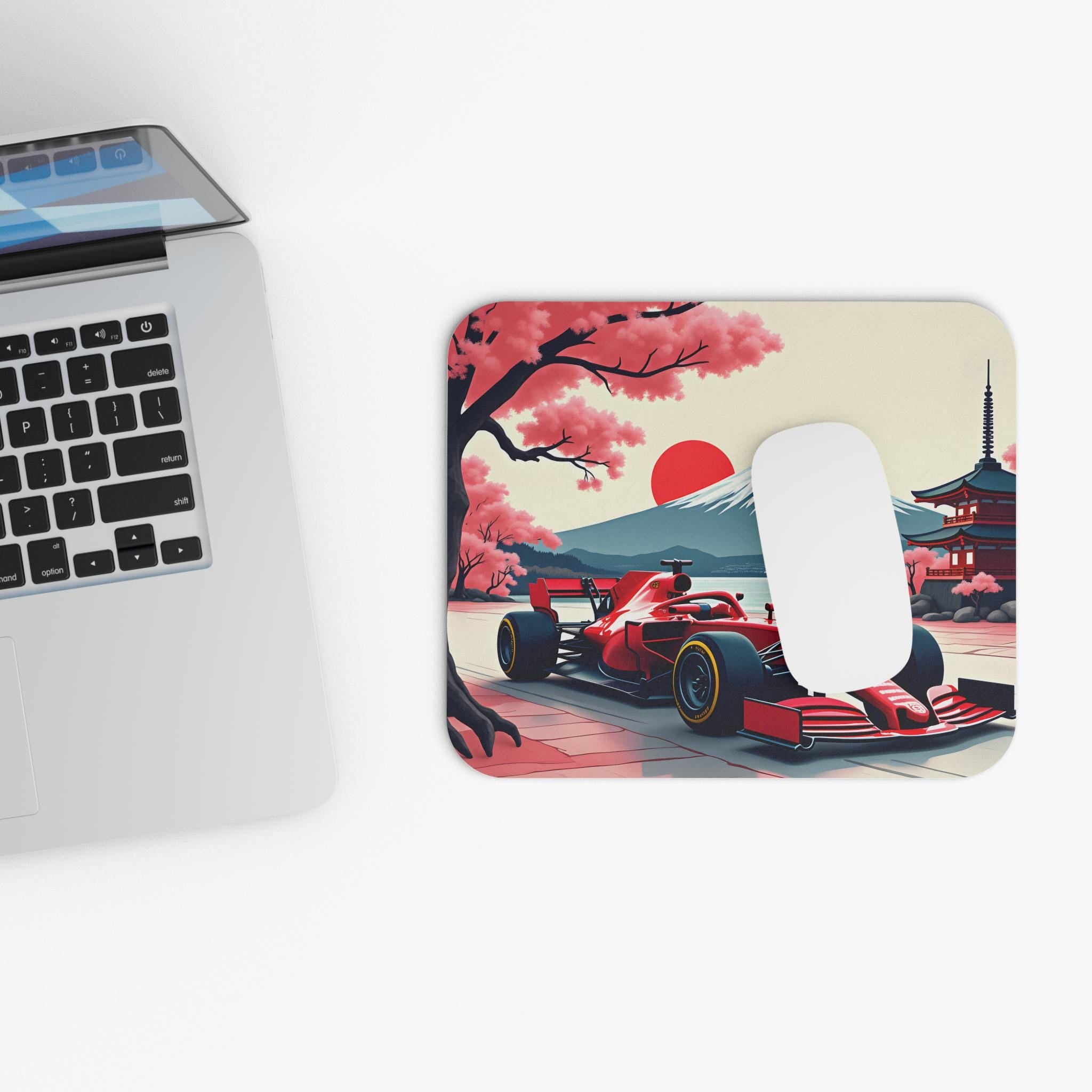 A red race car driving on a road with a mountain and cherry blossom trees in the background. The car is a Formula 1 car and is driving on a road with a mountain and cherry blossom trees in the background. The mountain is a stylized version of Mount Fuji and the cherry blossom trees are in full bloom. The car is driving towards the viewer and the mountain is in the background. The scene is a stylized version of a Japanese landscape.