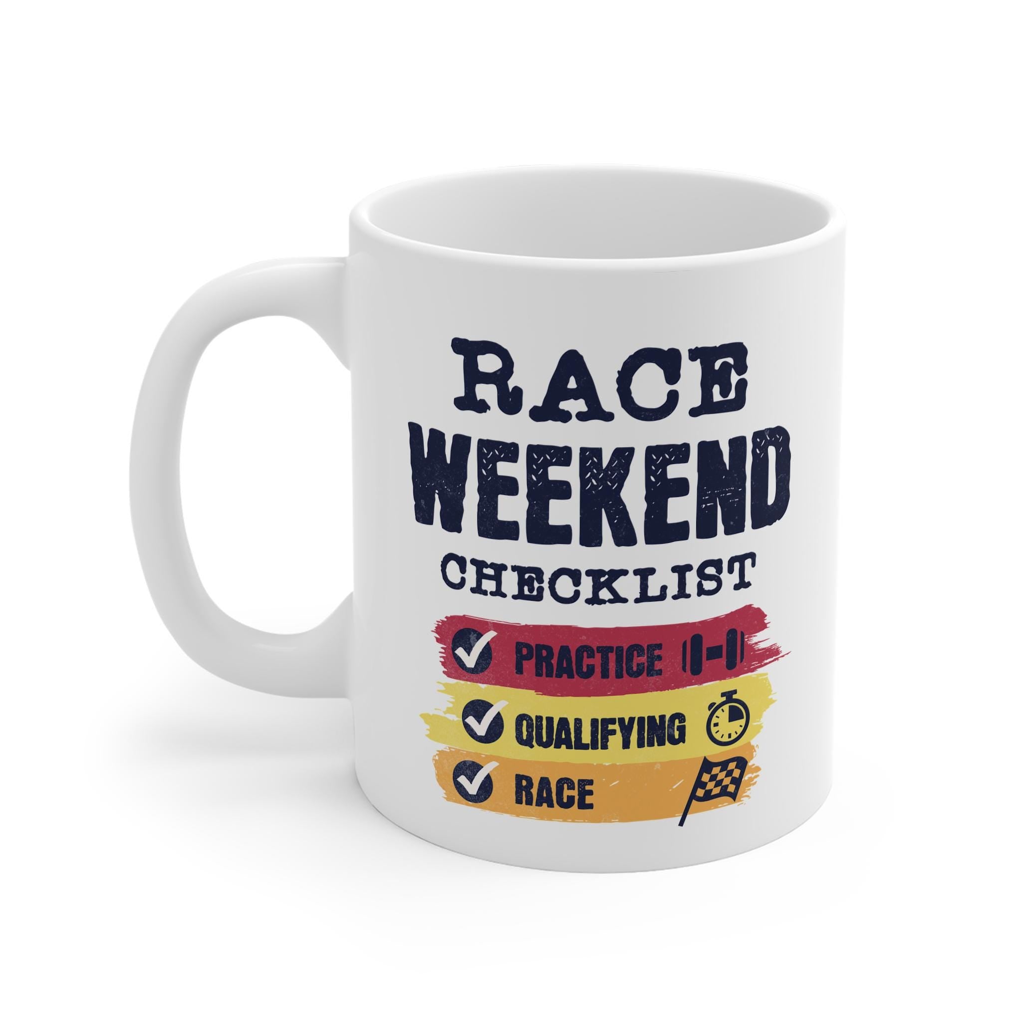 A white coffee mug with a black and white design that says 'Race Weekend Checklist' with check marks next to the words 'Practice', 'Qualifying', and 'Race'. The design also includes a small black and white icon of a dumbbell next to the word 'Practice', a black and white icon of a stopwatch next to the word 'Qualifying', and a black and white checkered flag icon next to the word 'Race'. The background of the mug is white.
